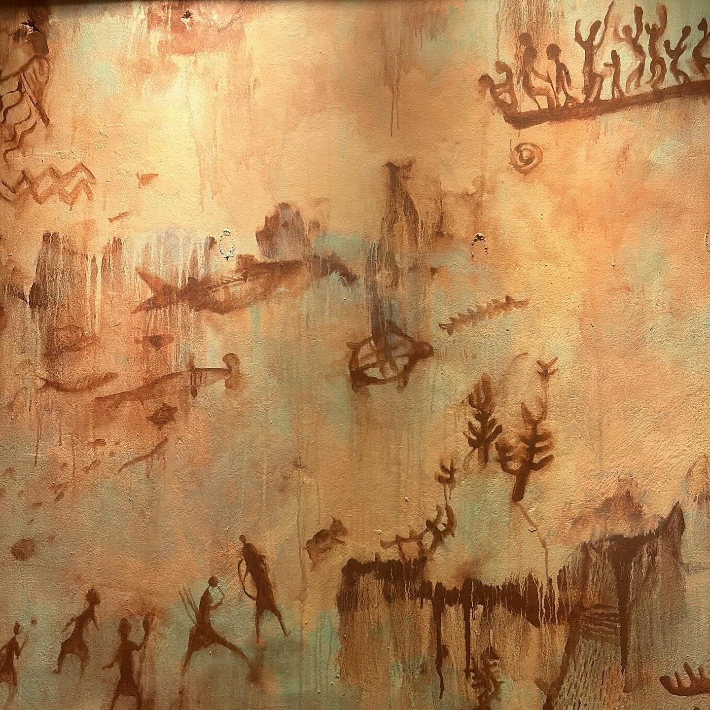 Ochre cave-painting-style mural at Bar Abong, with figures, fish and a longboat